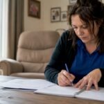 NDIS worker reviewing sleepover shift paperwork